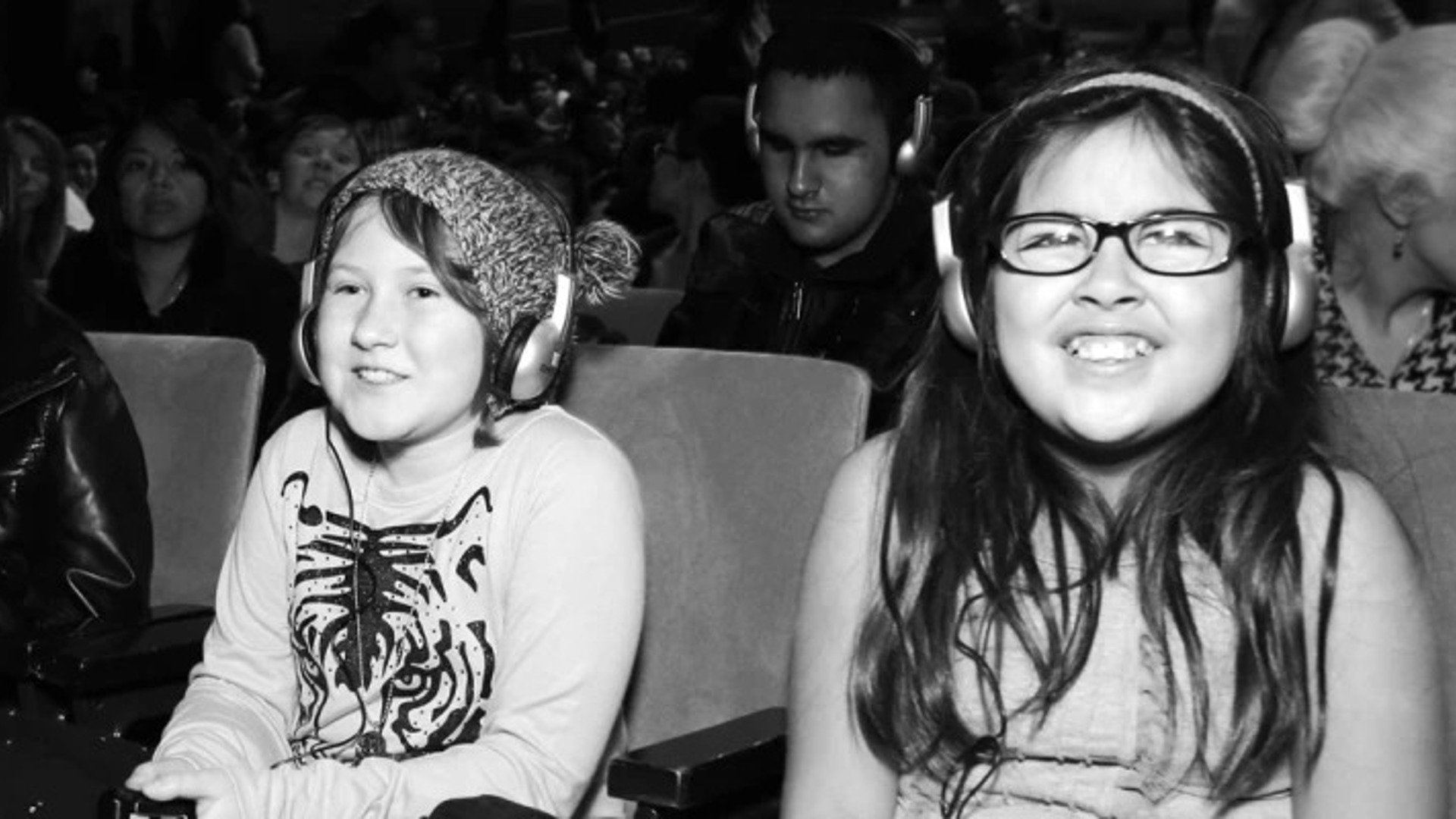 Children enjoying a CTG production wearing noise reduction headphones. 