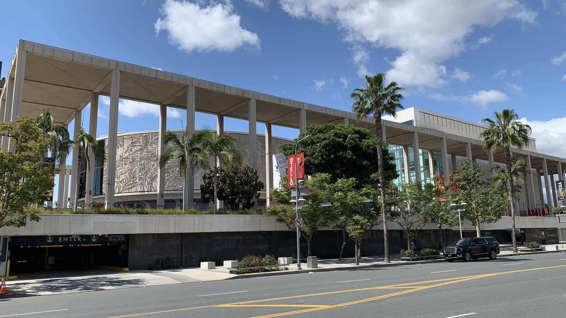 Exterior images of the Mark Taper Forum and the Ahmanson Theatre on a blue partially cloudy day. 