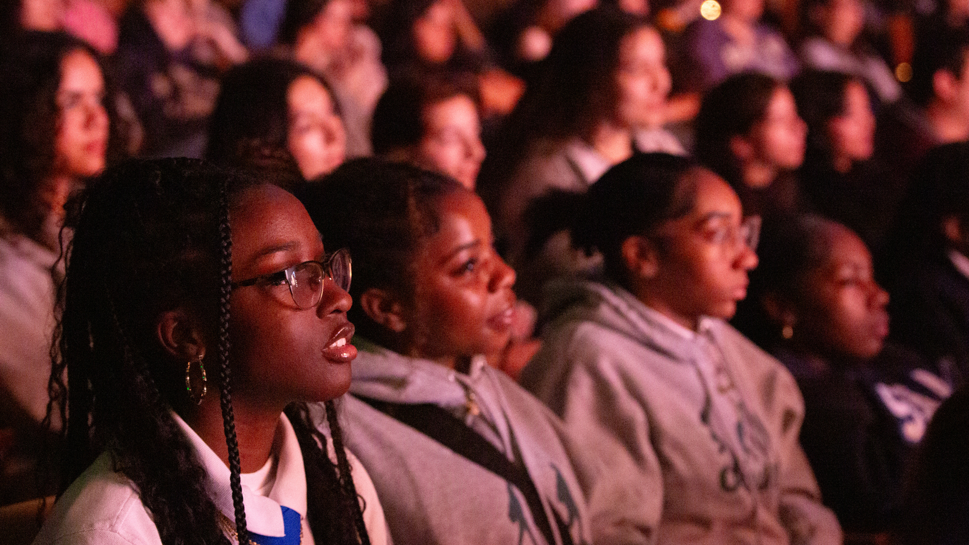 A student matinee audience enjoys a performance.